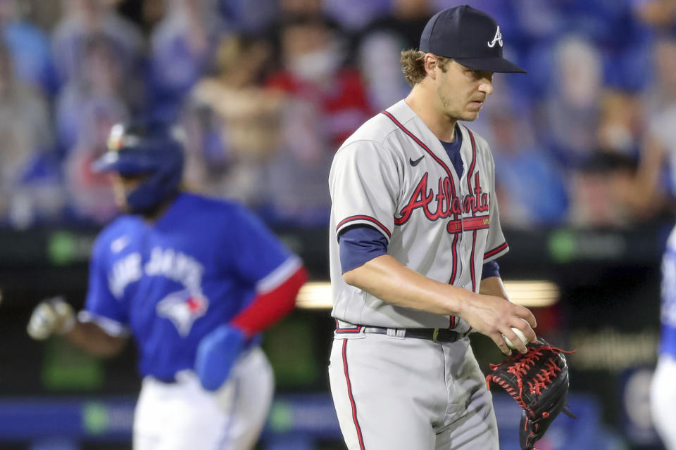 Atlanta Braves relief pitcher Jacob Webb reacts after giving up a three-run home run to Toronto Blue Jays' Teoscar Hernandez during the sixth inning of a baseball game Friday, April 30, 2021, in Dunedin, Fla. (AP Photo/Mike Carlson)