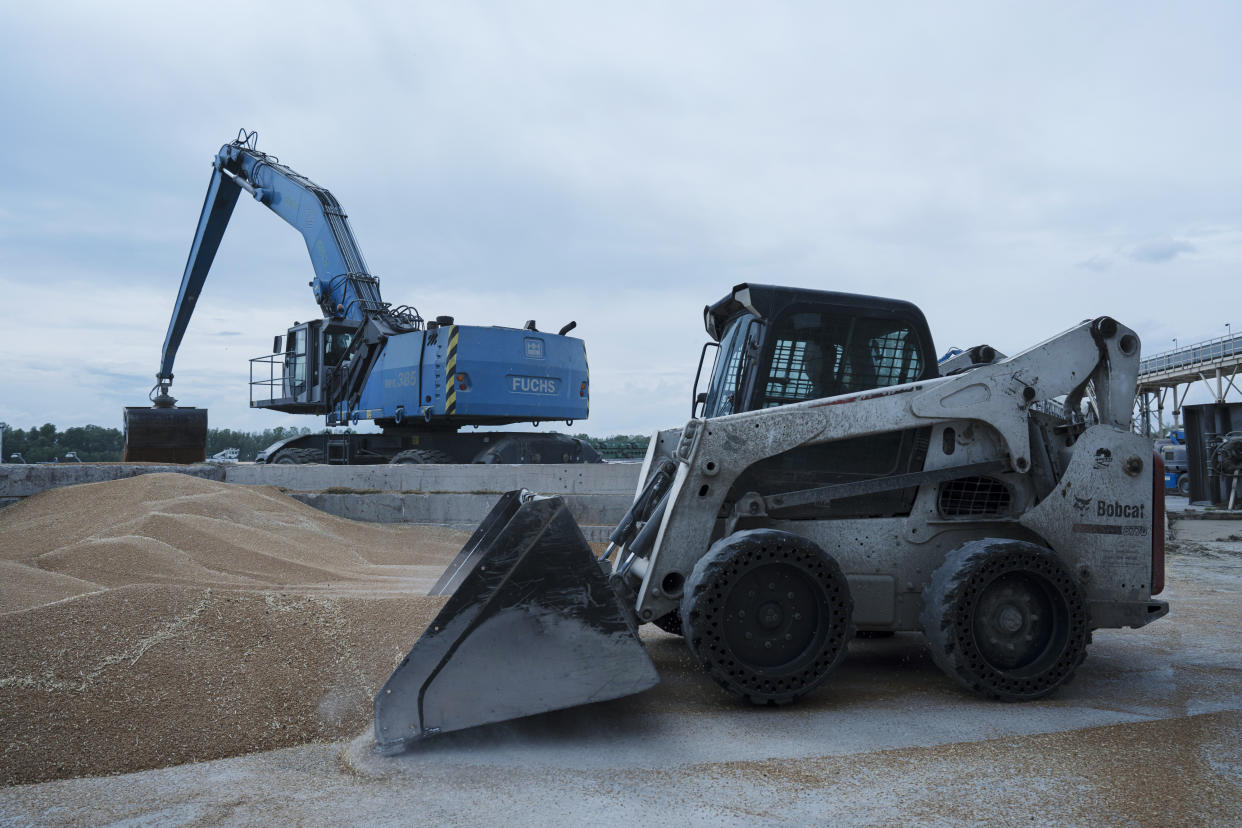 Excavators work at a grain port in Izmail, Ukraine, on April 26, 2023. (AP Photo/Andrew Kravchenko)