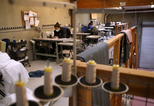 Garment workers in California sewing masks on April 6, 2020<p>Photo: Justin Sullivan/Getty Images</p>