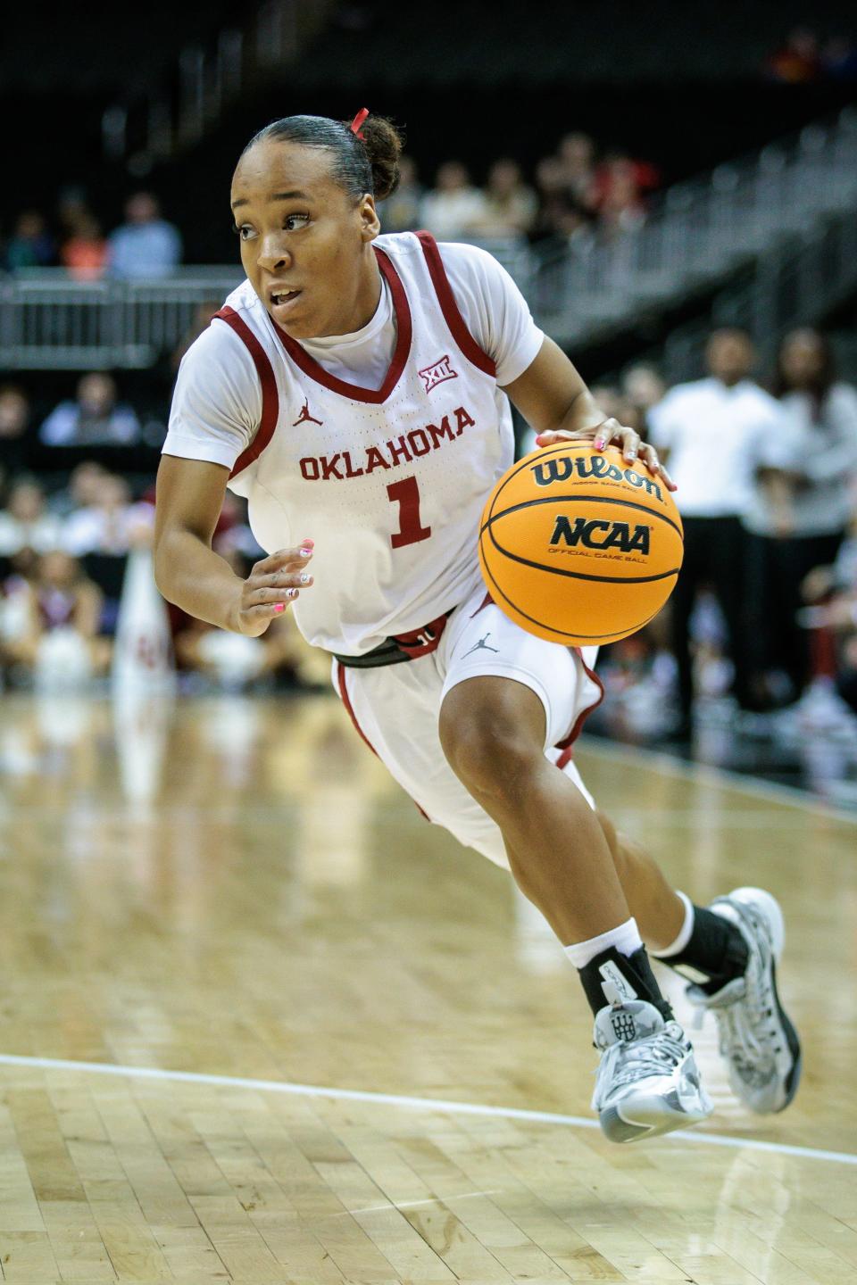 Mar 11, 2024; Kansas City, MO, USA; Oklahoma Sooners guard Nevaeh Tot (1) drives to the basket during the first half against the Iowa State Cyclones at T-Mobile Center. Mandatory Credit: William Purnell-USA TODAY Sports
