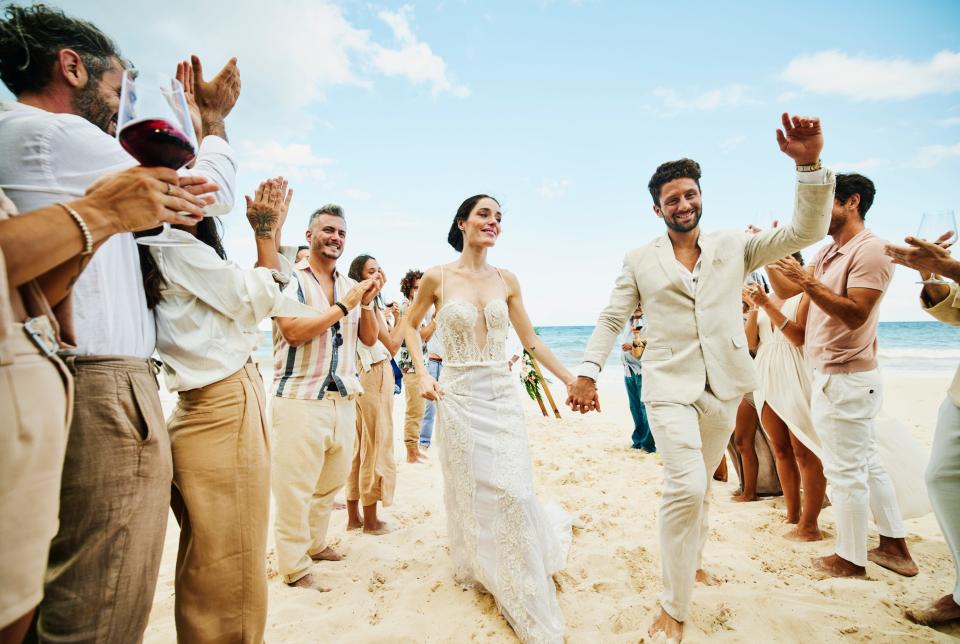 Couple getting married on the beach.