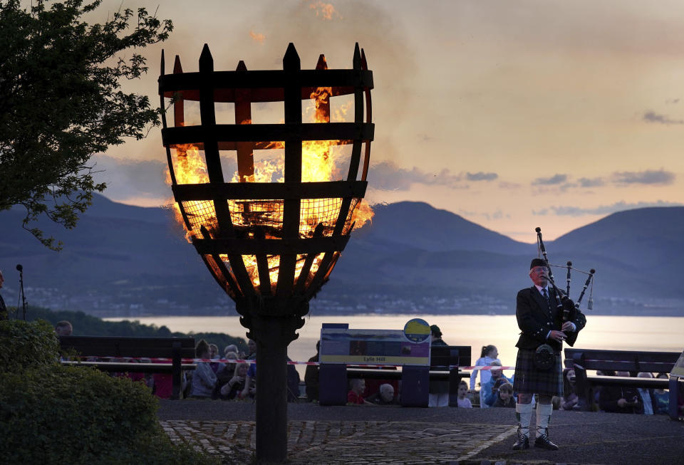 A Platinum Jubilee beacon is lit on Lyle Hill, Greenock, Scotland, Thursday June 2, 2022, on day one of the Platinum Jubilee celebrations. Over 1500 towns, villages and cities throughout the UK, Channel Islands, Isle of Man and UK Overseas Territories will come together to light a beacon to mark the Jubilee. (Andrew Milligan/PA via AP)