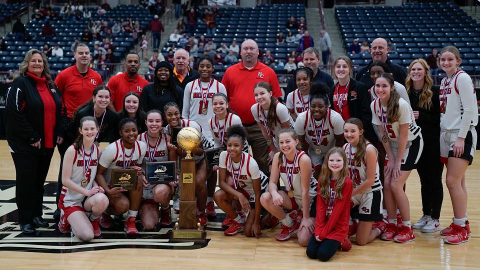 The Holy Cross Indians pose with their All "A" state championship trophy.