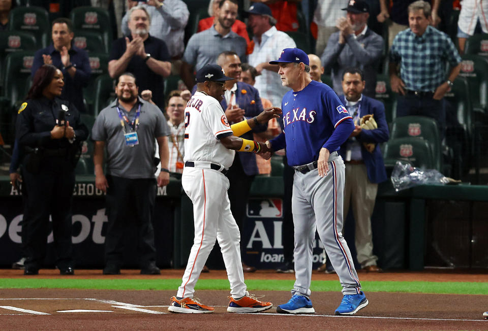 Astros manager Dusty Baker and Rangers manager Bruce Bochy shake hands before Game 1 of the ALCS. (Rob Carr/Getty Images)