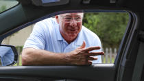 Glenn Cook, a Republican campaigning for a seat in the Georgia state House, speaks with a driver in Kingsland, Ga., Tuesday, June 11, 2024. (AP Photo/Gary McCullough)