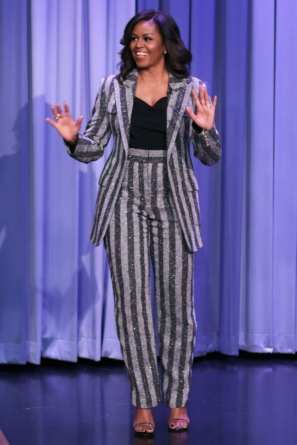 <p><strong>December 2018</strong> Michelle Obama wore a striped sequinned Balmain suit during the promotional tour for her book Becoming.</p>