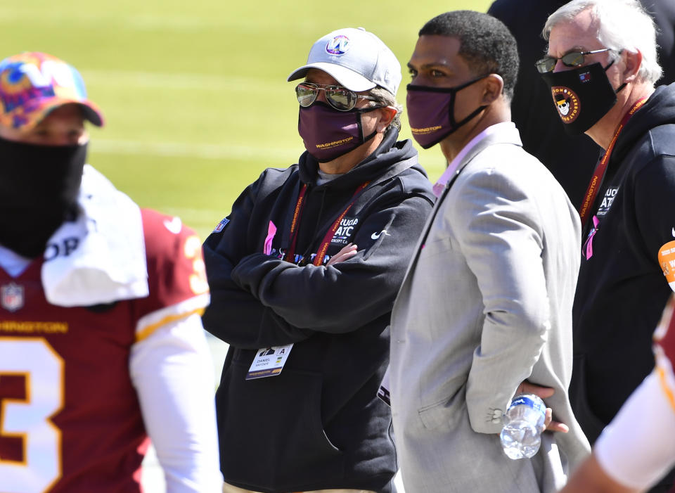 Oct 4, 2020; Landover, Maryland, USA; Washington Football Team owner Daniel Snyder and Washington Football Team President Jason Wright on the field before the game against the Baltimore Ravens at FedExField. Mandatory Credit: Brad Mills-USA TODAY Sports