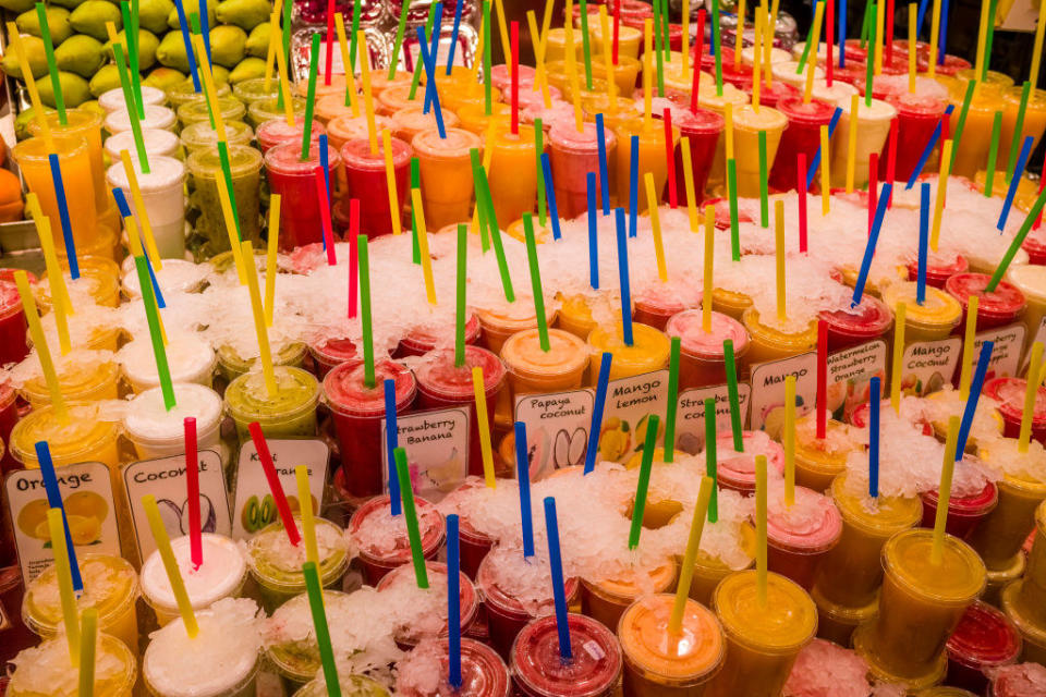 Colorful juices at a market.