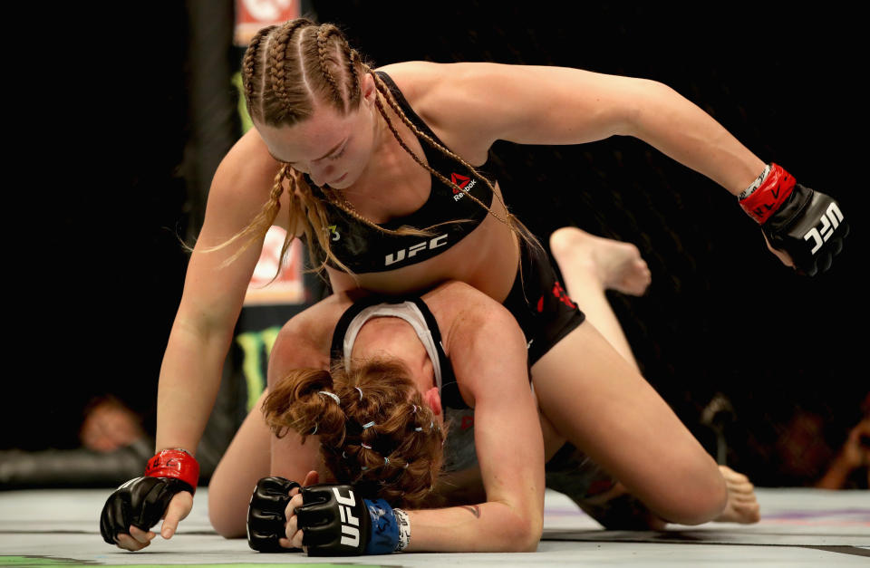 Aspen Ladd (top) beats Tonya Evinger (bottom) to a TKO in their women's bantamweight bout during the UFC 229 event inside T-Mobile Arena on October 6, 2018 in Las Vegas, Nevada.