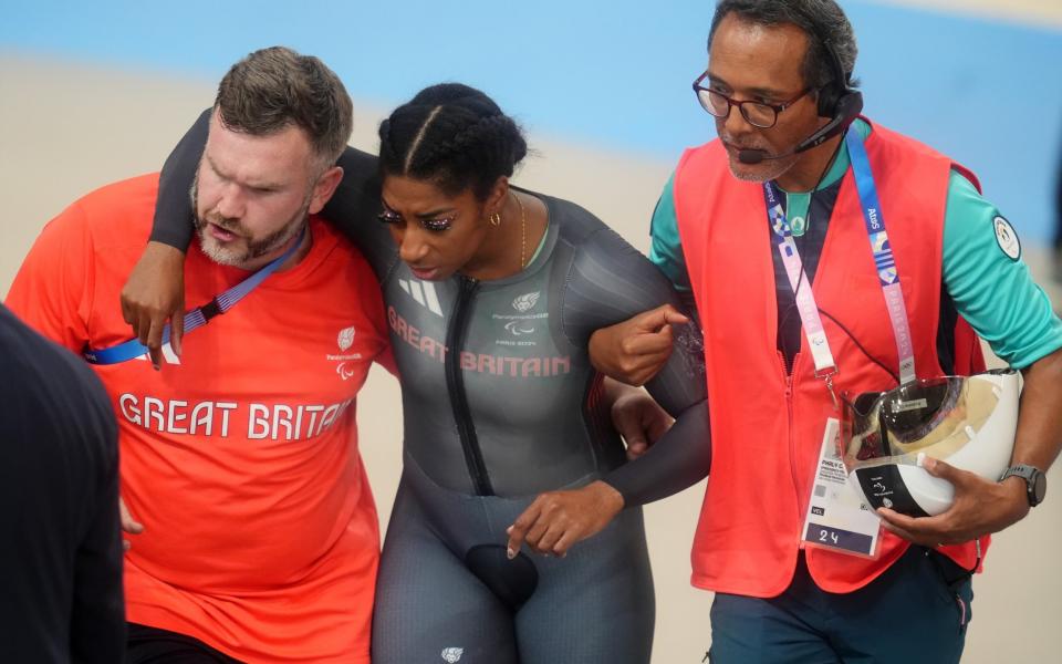 Great Britain's Kadeena Cox is helped after crashing in the Women's C4-5 500m Time Trial Final during the Para Track Cycling at the National Velodrome on day one of the Paris 2024 Summer Paralympic Games. Picture date: Thursday August 29, 2024.