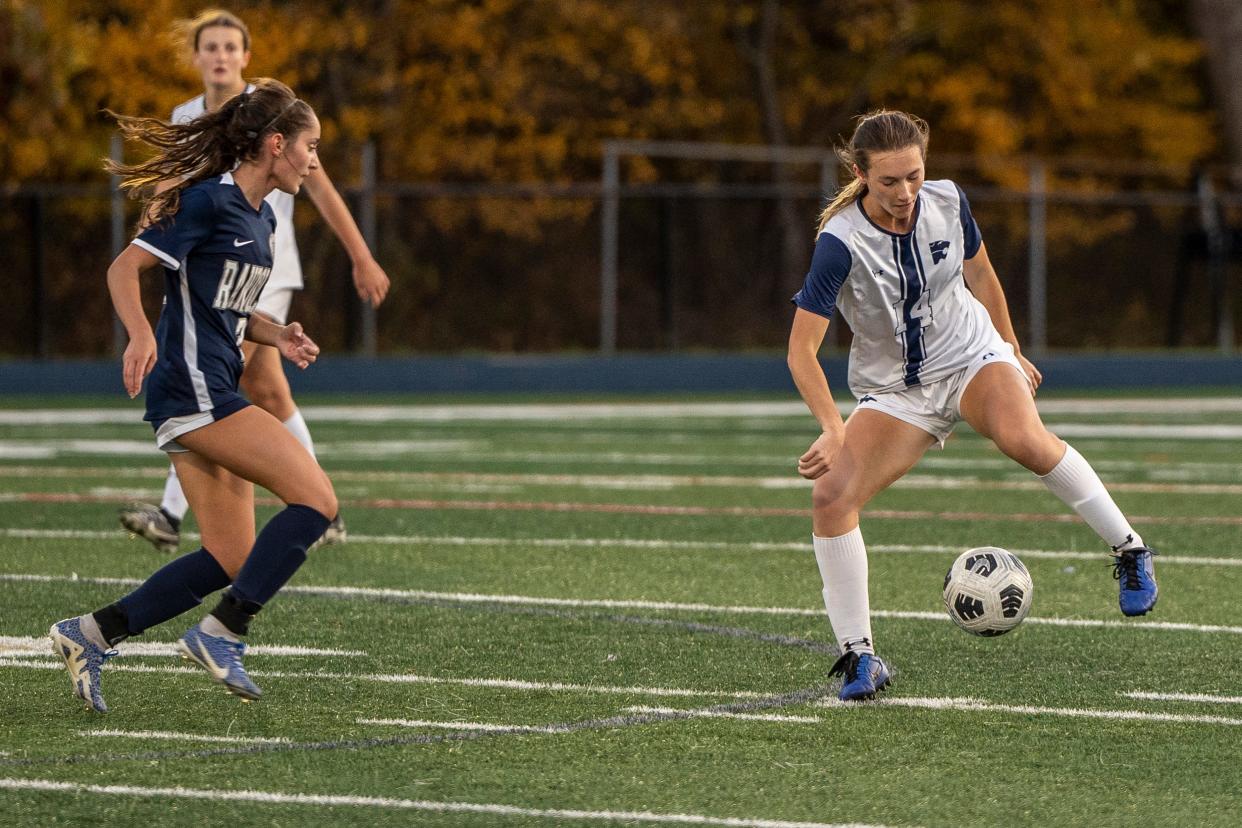 R #2 Chelsea Renna and C #14 Riley Cross with the ball. Randolph plays Chatham in the Morris County Tournament girls soccer finals on Saturday, October 21, 2023.