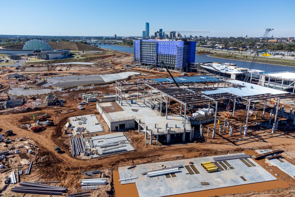 The downtown skyline and Oklahoma River are seen in the distance of the OKANA resort.