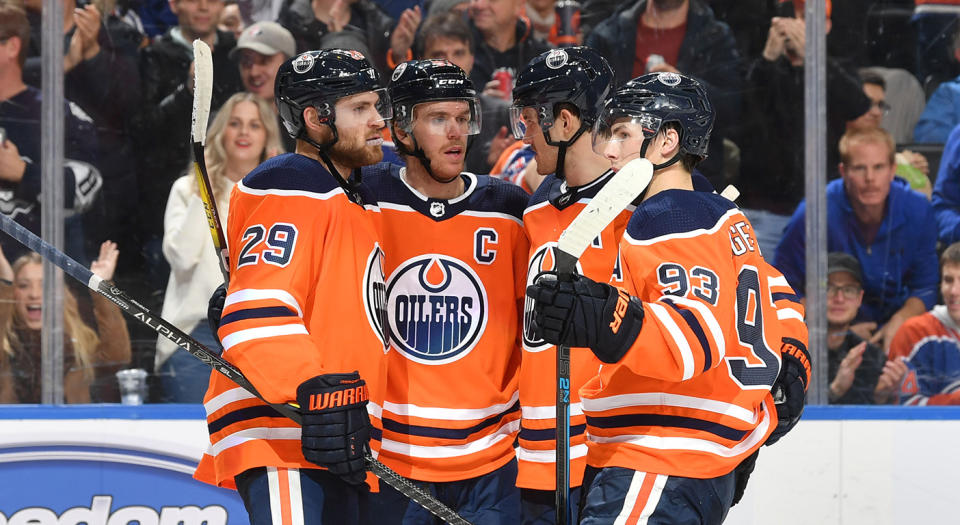 EDMONTON, AB - NOVEMBER 14:  Leon Draisaitl #29, Connor McDavid #97, Oscar Klefbom #77 and Ryan Nugent-Hopkins #93 of the Edmonton Oilers celebrate after a goal during the game against the Colorado Avalanche on November 14, 2019, at Rogers Place in Edmonton, Alberta, Canada. (Photo by Andy Devlin/NHLI via Getty Images)