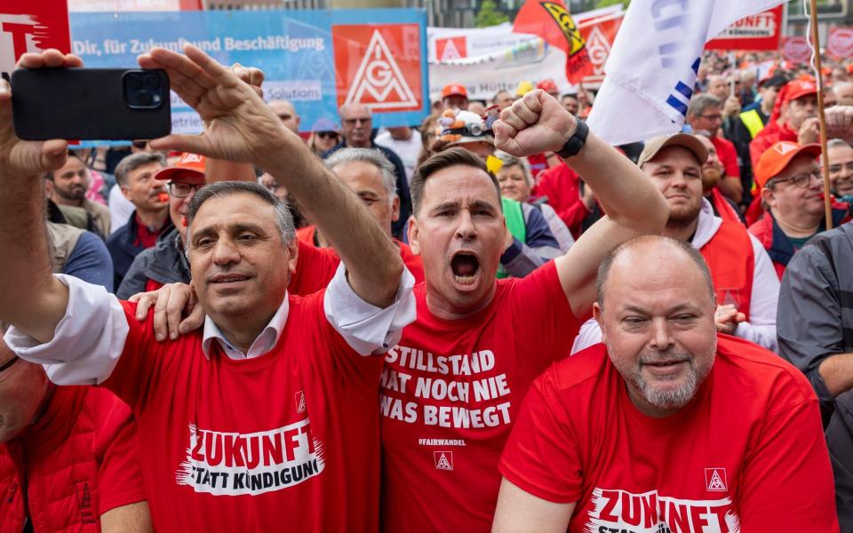 ThyssenKrupp steelworkers rally at an IG Metall union protest in Essen, Germany, last month