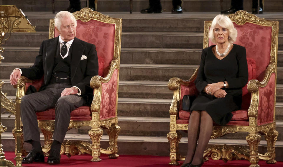 Britain's King Charles III, left, and Camilla, the Queen Consort, sit at Westminster Hall, where both Houses of Parliament are meeting to express their condolences following the death of Queen Elizabeth II, at Westminster Hall, in London, Monday, Sept. 12, 2022. Queen Elizabeth II, Britain's longest-reigning monarch, died Thursday after 70 years on the throne. (Henry Nicholls/Pool Photo via AP)