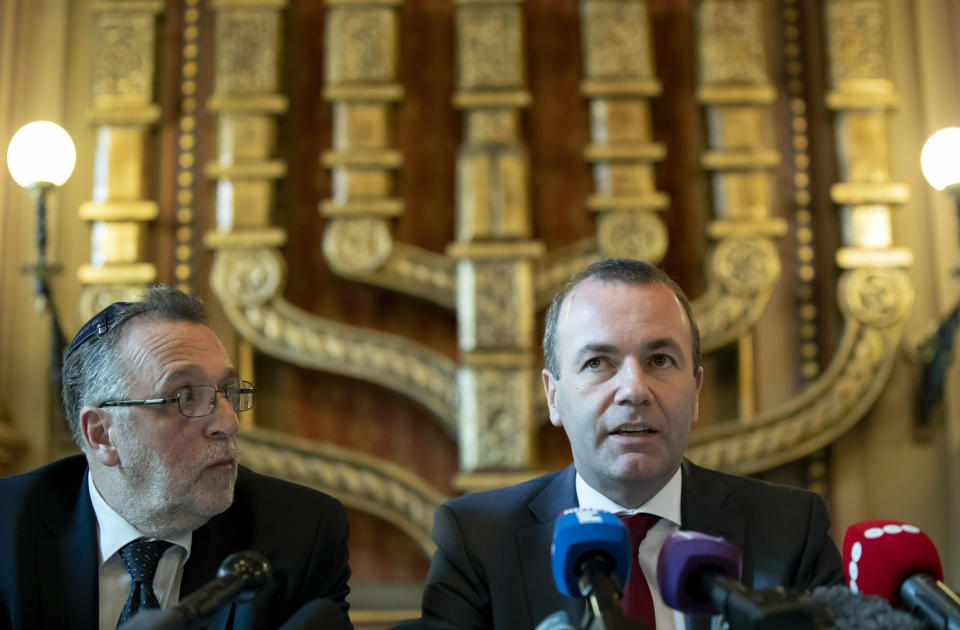 Chairman of the European People's Party (EPP) Group in the European Parliament Manfred Weber and President of the Federation of Jewish Religious Communities of Hungary (Mazsihisz) Andras Heisler, left, attends a press conference in the Dohany Street Synagogue in Budapest, Hungary, Tuesday, March 12, 2019. Weber said that a meeting with Hungary's prime minister has not resolved the issues that could lead to the expulsion of Hungary's Fidesz party from the bloc. (Balazs Mohai/MTI via AP)