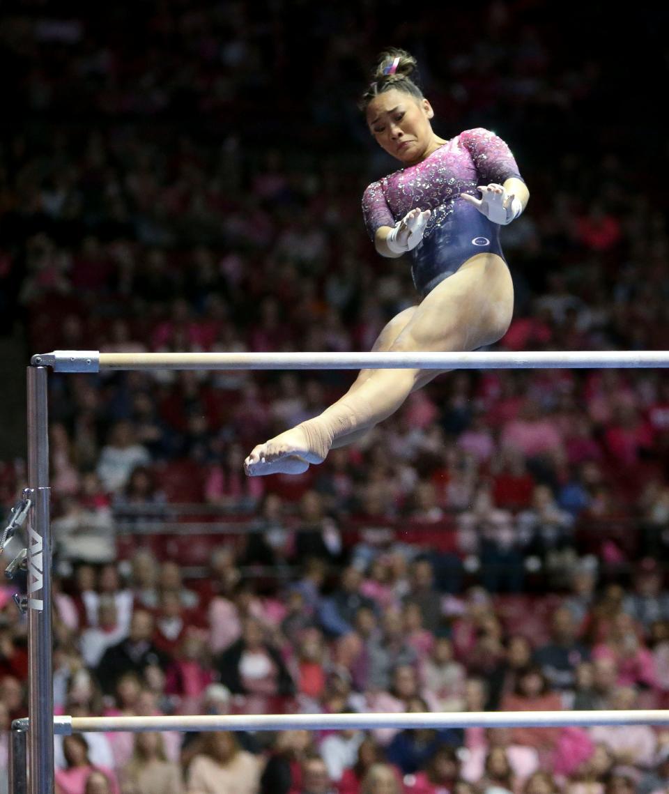 Feb 3, 2023; Tuscaloosa, AL, USA;  Auburn gymnast Suni Lee competes on the bars where she scored a perfect 10.0 at Coleman Coliseum. Alabama edged Auburn 197.850 to 197.700.