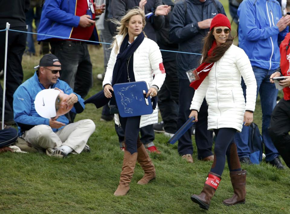 Tabitha Furyk (L) and Sybi Kuchar, wives of Team U.S. players Jim Furyk and Matt Kuchar, watch foursomes 40th Ryder Cup matches at Gleneagles in Scotland September 26, 2014. REUTERS/Phil Noble (BRITAIN - Tags: SPORT GOLF)