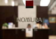 FILE PHOTO: The logo of Nomura Securities is seen at the company's Head Office in Tokyo, Japan, November 28, 2016. REUTERS/Toru Hanai/File Photo