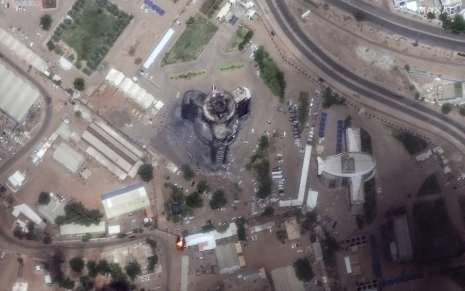 This satellite image provided by Maxar Technologies shows the burned and heavily damaged general command of the Sudanese armed forces headquarter building in Khartoum, Sudan, Sunday April 16, 2023. The Sudanese military and a powerful paramilitary group are battling for control of the chaos-stricken nation for a second day. (Satellite image ©2023 Maxar Technologies via AP)