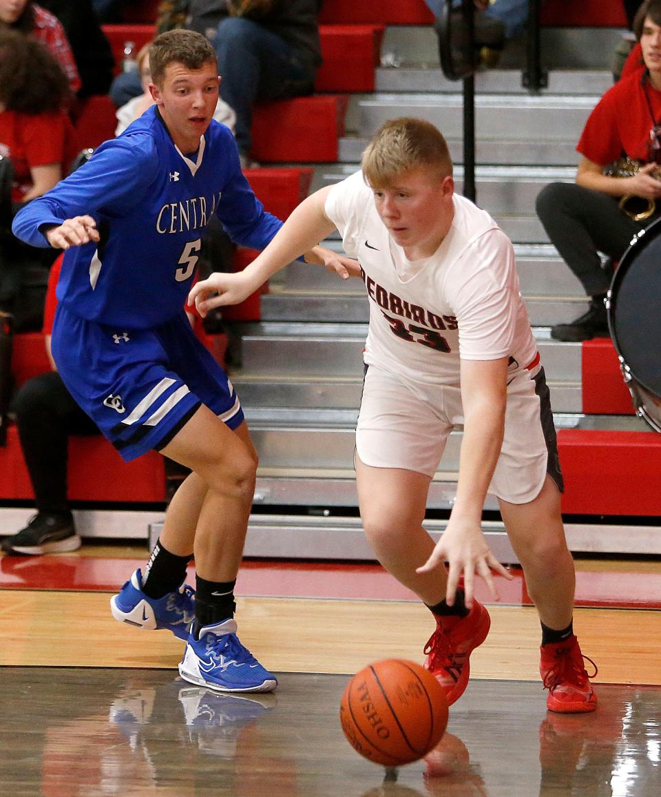 Loudonville High School's Judah Layton (33) drives the baseline against Central Christian High School's Bryan Martin (5) during high school boys basketball action Friday, Dec. 9, 2022. TOM E. PUSKAR/ASHLAND TIMES-GAZETTE