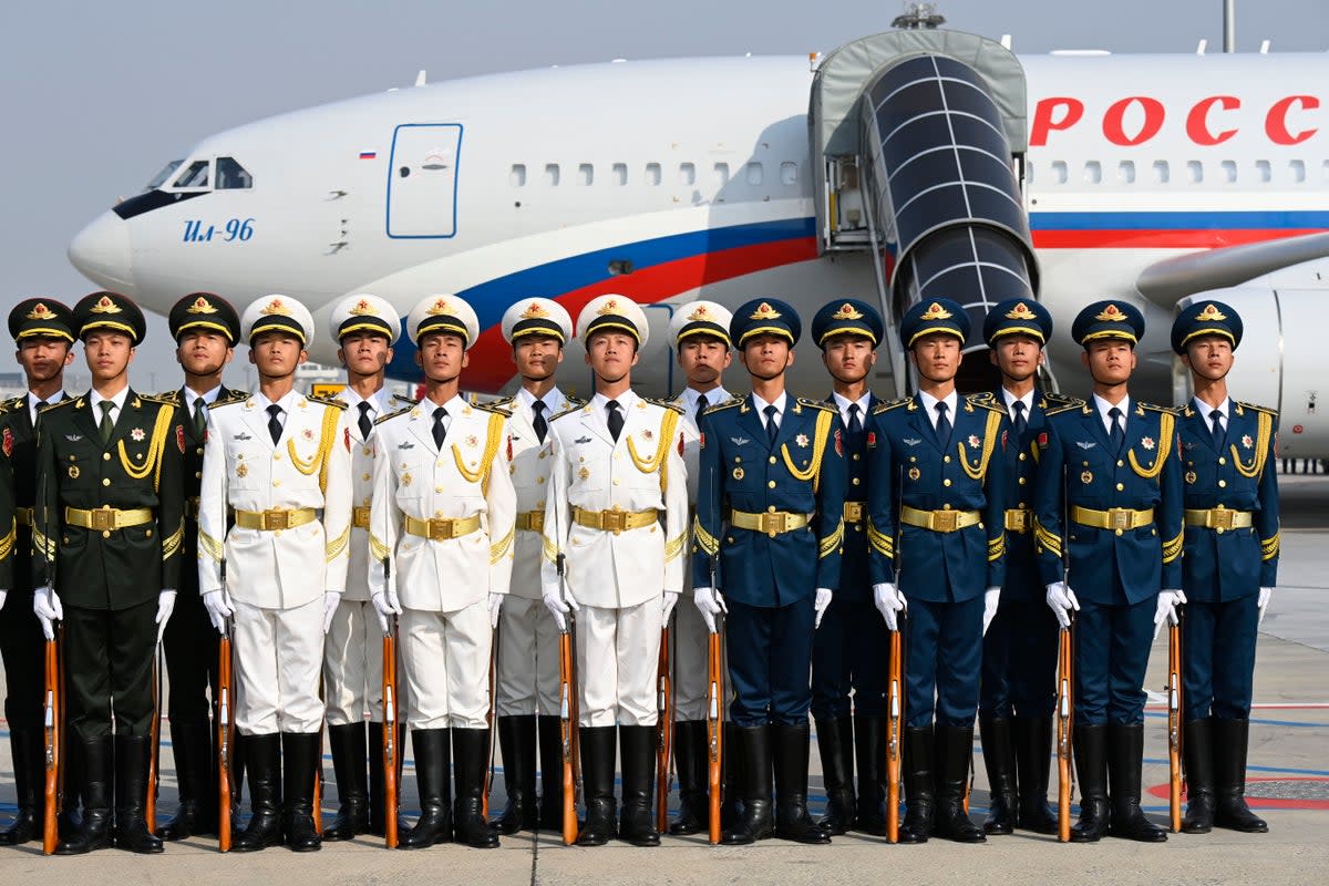 Chinese honor guards are seen after welcoming Russia's President Vladimir Putin at Beijing Capital International Airport (Getty Images)