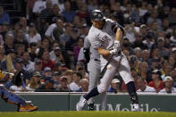 New York Yankees designated hitter Giancarlo Stanton (27) hits a three-run home run during the third inning of a baseball game against the Boston Red Sox at Fenway Park, Friday, Sept. 24, 2021, in Boston. (AP Photo/Mary Schwalm)