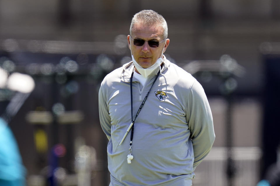 Jacksonville Jaguars head coach Urban Meyer watches players run drills during NFL football rookie minicamp, Saturday, May 15, 2021, in Jacksonville, Fla. (AP Photo/John Raoux)