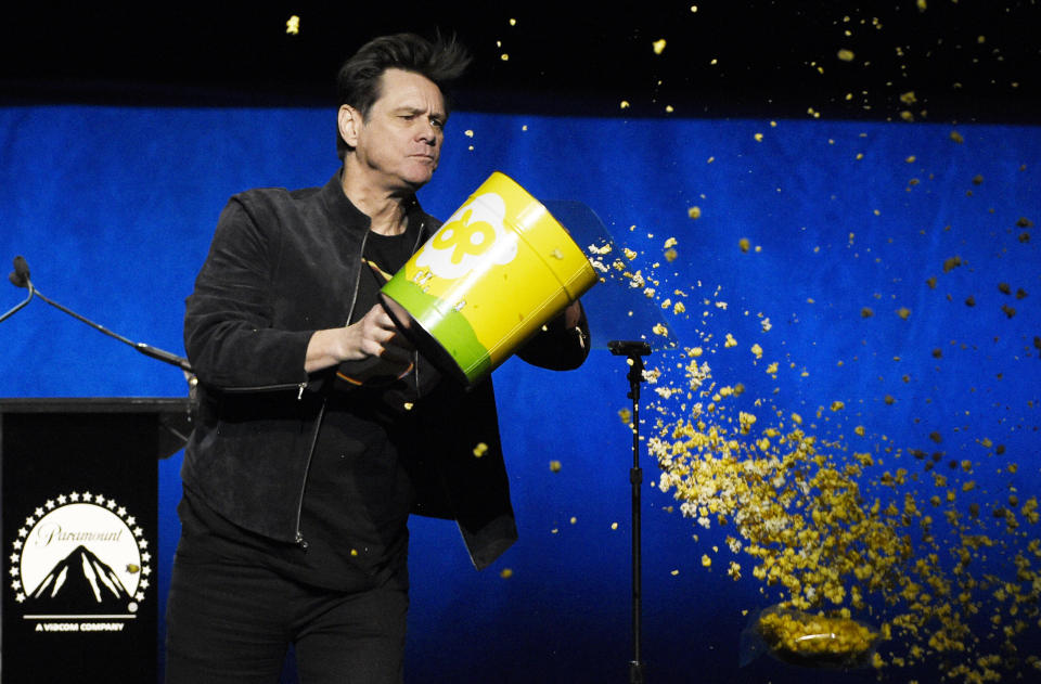 Jim Carrey, a cast member in the upcoming film "Sonic the Hedgehog," dumps out a tub of popcorn during the Paramount Pictures presentation at CinemaCon 2019, the official convention of the National Association of Theatre Owners (NATO) at Caesars Palace, Thursday, April 4, 2019, in Las Vegas. (Photo by Chris Pizzello/Invision/AP)