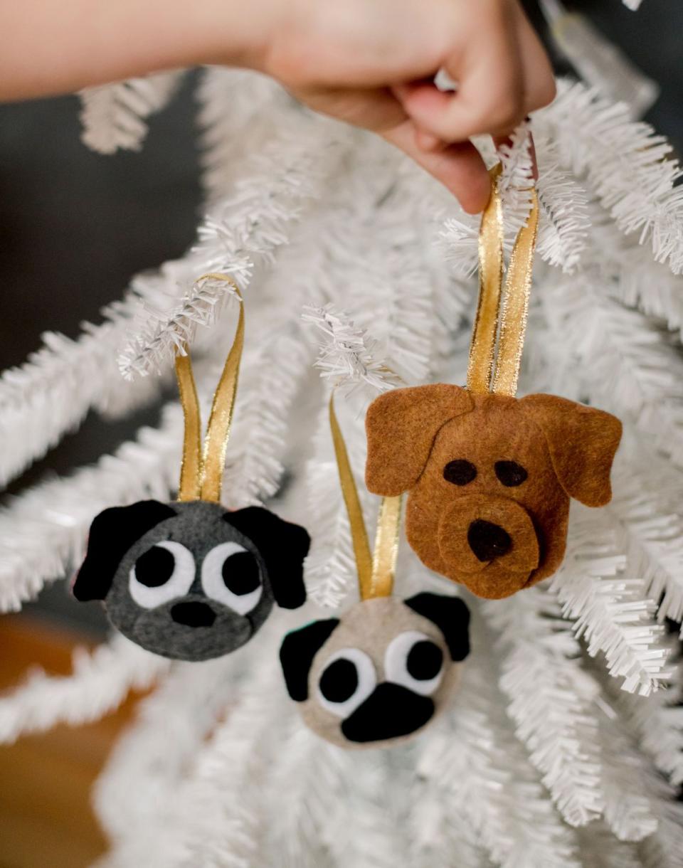 <p>There are two templates that make this project super easy to do. Choose colors that coordinate with your family's favorite pup!</p><p><em><a href="https://ohyaystudio.com/plush-felt-dog-christmas-ornament-or-stocking-tag/" rel="nofollow noopener" target="_blank" data-ylk="slk:Get the tutorial at Oh Yay Studio »;elm:context_link;itc:0;sec:content-canvas" class="link ">Get the tutorial at Oh Yay Studio »</a></em></p>