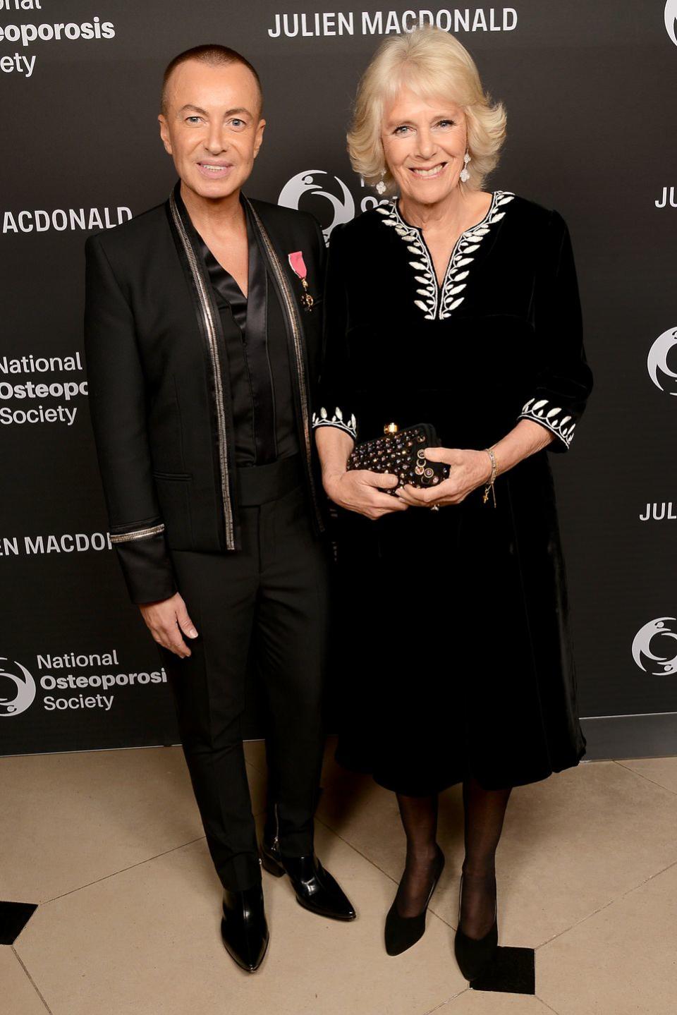 <p>The Duchess of Cornwall recycled a black velvet dress from earlier this month to attend the Julien Macdonald, on the left, Fashion Show for the National Osteoporosis Society. </p>