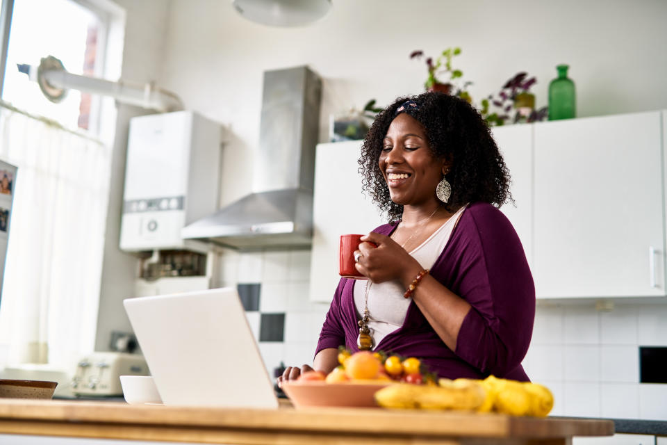 Remote work Black woman drinking coffee and working from home, relaxed businesswoman, solopreneur, confidence, individuality