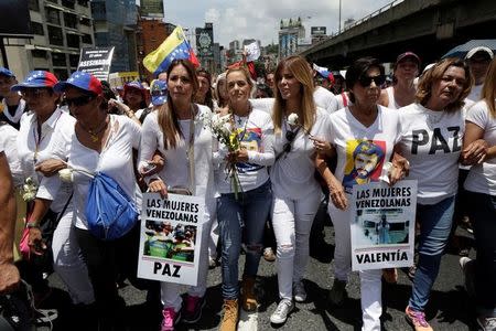 Lilian Tintori (C), wife of jailed Venezuelan opposition leader Leopoldo Lopez, attends a women's march to protest against President Nicolas Maduro's government in Caracas, Venezuela, May 6, 2017. REUTERS/Marco Bello