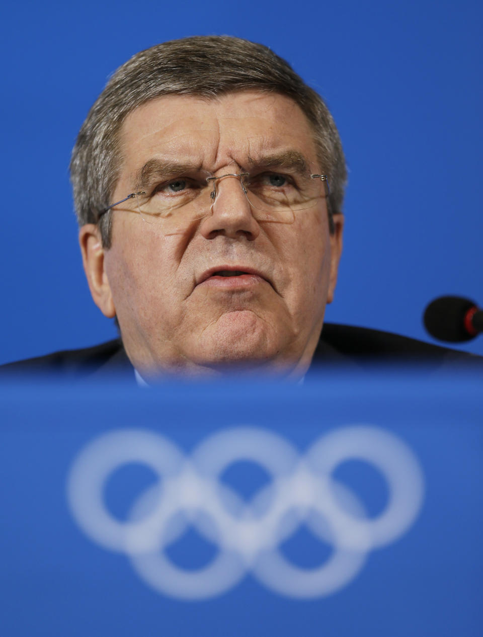International Olympic Committee President Thomas Bach answers a question during a news conference at the 2014 Winter Olympics, Sunday, Feb. 23, 2014, in Sochi, Russia. (AP Photo/Morry Gash)
