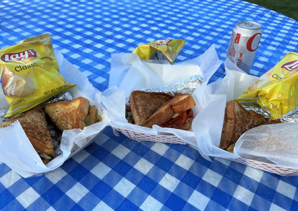 The Cheese Boss Food Truck features gourmet grilled cheese sandwiches