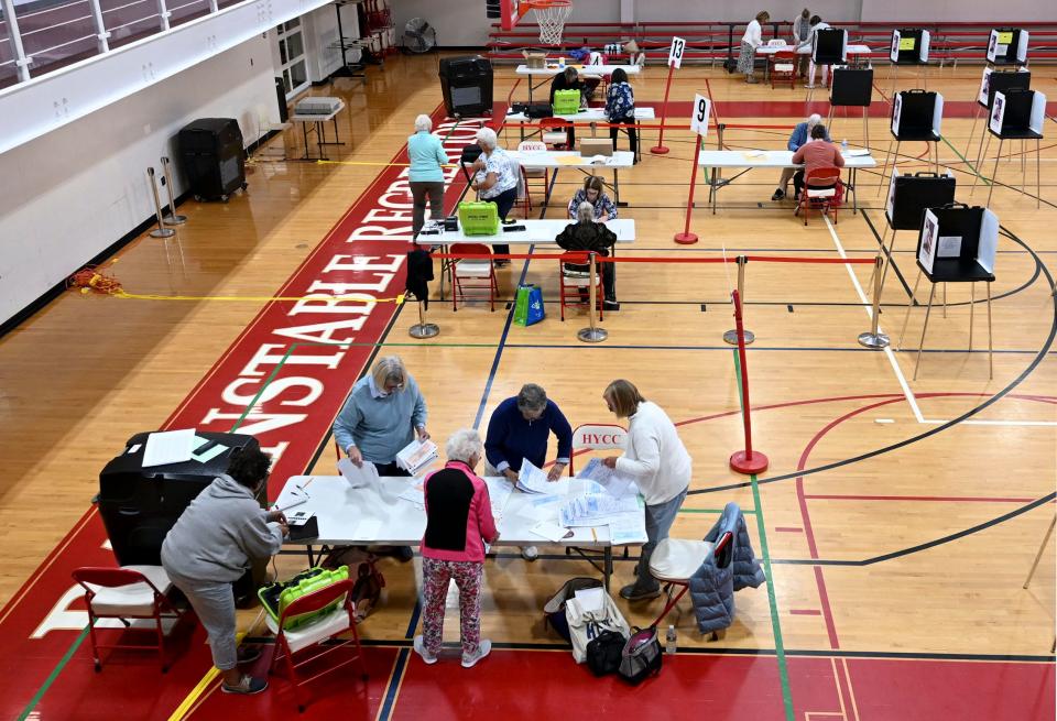 Election workers counted ballots for Barnstable precincts 8, 9 and 13 at the Hyannis Youth and Community Center into early Wednesday morning.