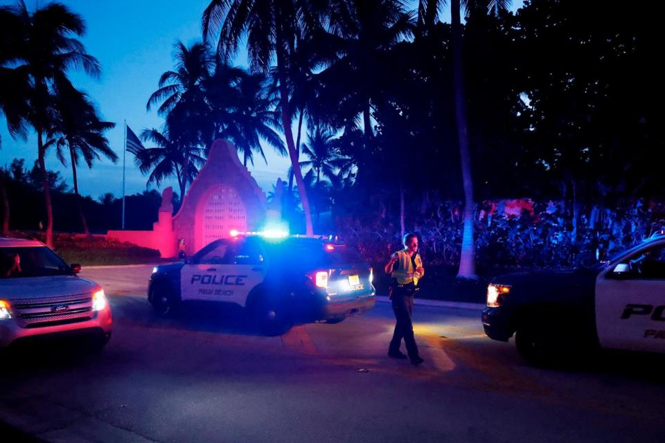 PHOTO: Police direct traffic outside an entrance to former President Donald Trump's Mar-a-Lago estate, Aug. 8, 2022, in Palm Beach, Fla.  (Terry Renna/AP, FILE)