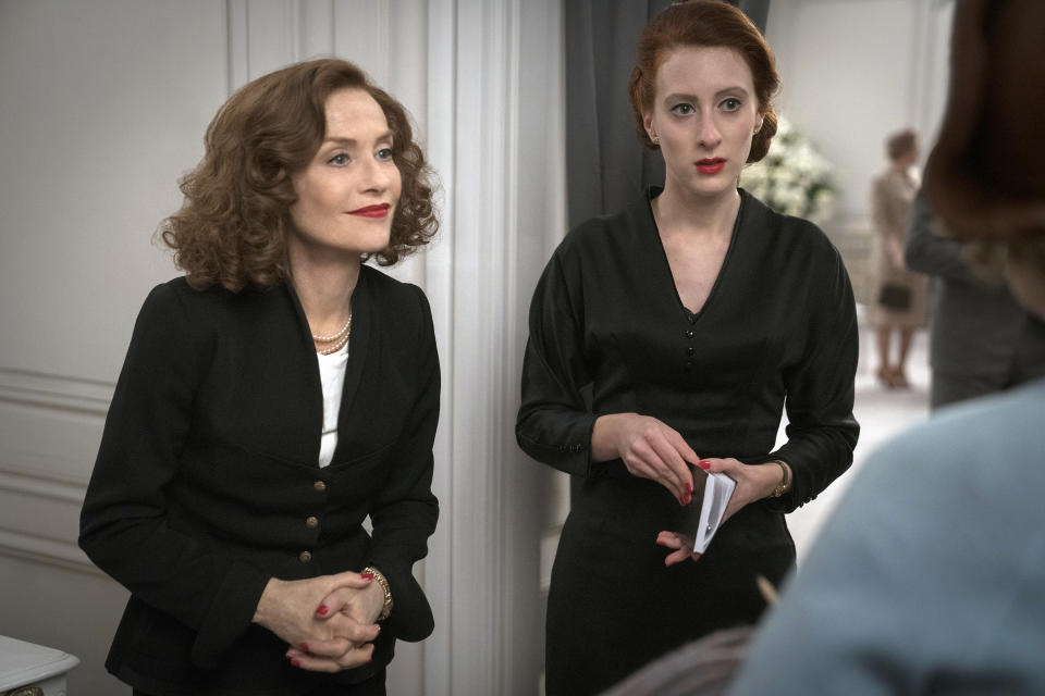 This image released by Focus Features shows Isabelle Huppert, left, and Roxane Duran in a scene from "Mrs. Harris Goes to Paris." (Liam Daniel/Focus Features via AP)