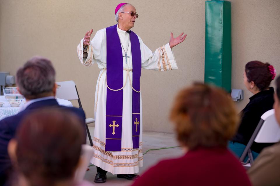 Bishop Mark J. Seitz conducts a worship service on Ash Wednesday at the El Pasoans Fighting Hunger Food Bank on Wednesday, Feb. 14, 2024.