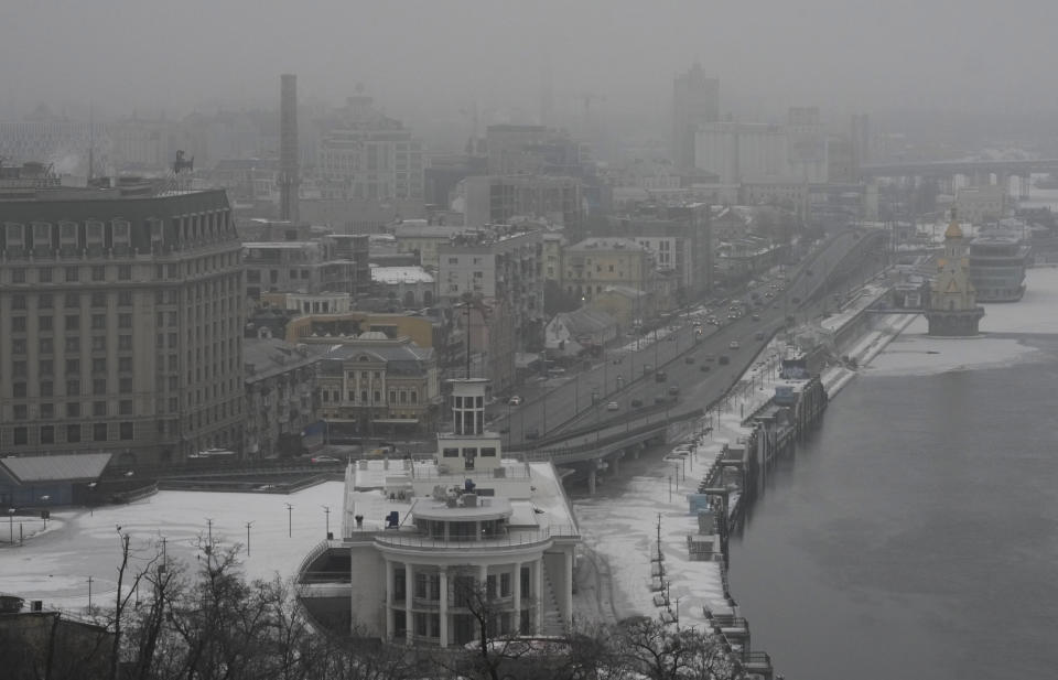 Fog covers Kyiv city center, Ukraine, Saturday, Jan. 14, 2023. A series of explosions rocked Kyiv on Saturday morning and minutes later air raid sirens started to wail as an apparent missile attack on the Ukrainian capital was underway. (AP Photo/Efrem Lukatsky)