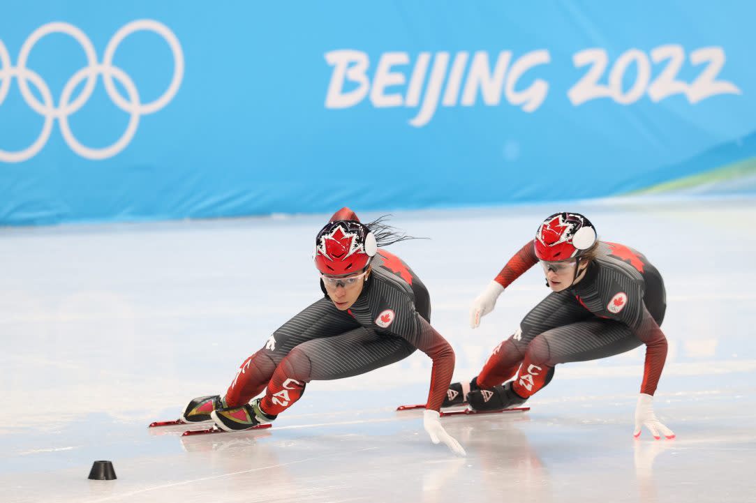 Alyson Charles and Kim Boutin of Team Canada at speed-skating practice for the 2022 Beijing Winter Olympics. These Games are projected to cost 10 times what China projected, according to Insider.