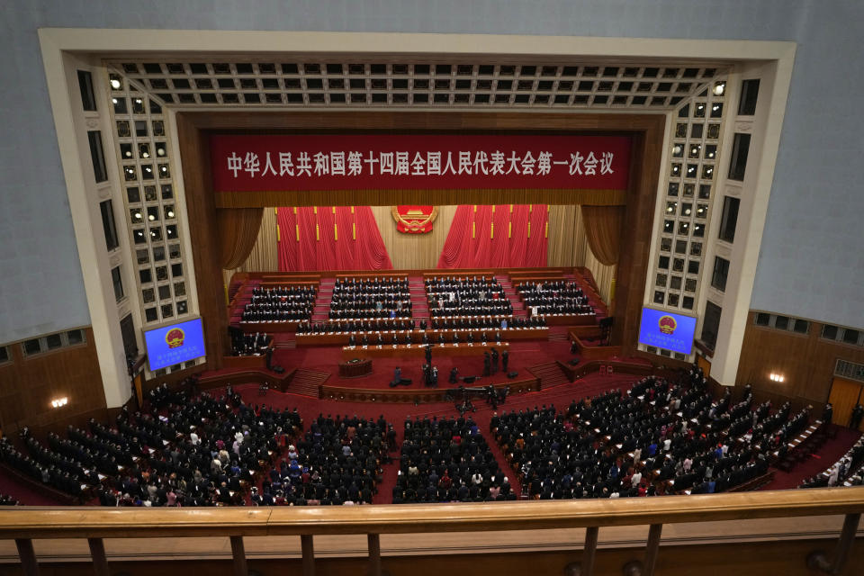 Delegates attend the opening session of China's National People's Congress (NPC) at the Great Hall of the People in Beijing, Sunday, March 5, 2023. (AP Photo/Ng Han Guan)