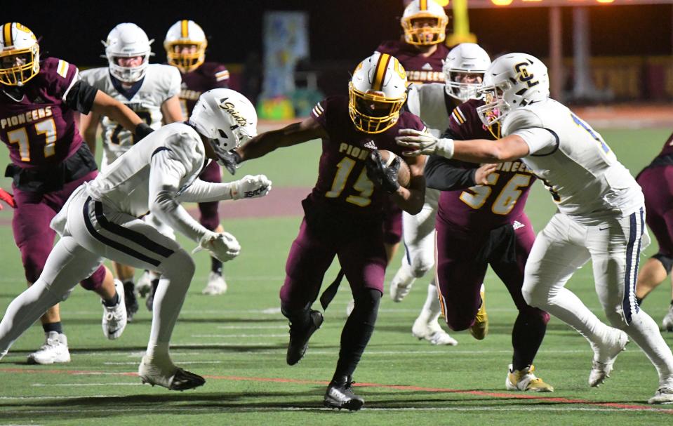 Simi Valley's Brice Hawkins tries to split the defense during the Pioneers' 27-7 win over Crean Lutheran in a CIF-SS Division 6 quarterfinal game on Nov. 10.