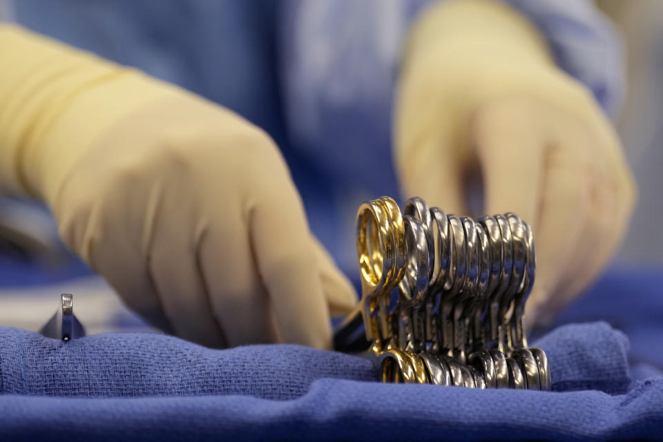 Surgical instruments are arranged during an organ procurement surgery June 15, 2023, in Jackson, Tenn. (AP Photo/Mark Humphrey)