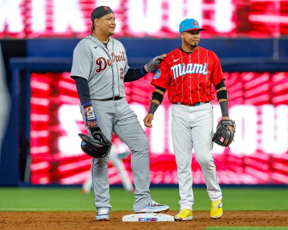 Miami Marlins second baseman Luis Arraez (3) greets Detroit Tigers designated hitter Miguel Cabrera (24) after taking second base in the second inning at loanDepot park in Miami on Saturday, July 29, 2023.