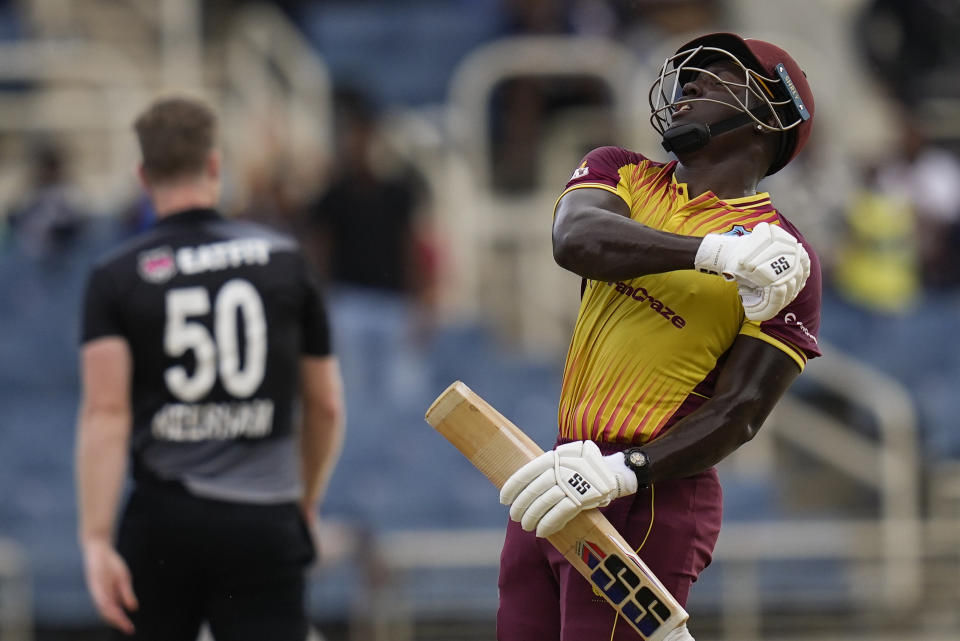 West Indies' captain Rovman Powell celebrates hitting a six to defeat New Zealand by eight wickets during the third T20 cricket match at Sabina Park in Kingston, Jamaica, Sunday, Aug. 14, 2022. (AP Photo/Ramon Espinosa)