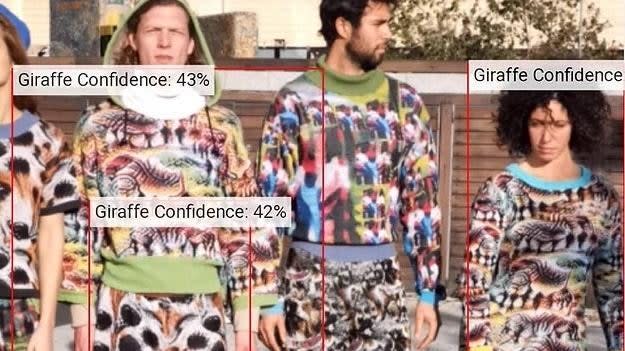 A gr0uop of people wearing anti facial recognition clothes being misidentified as giraffes.