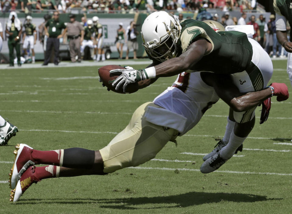 <p>South Florida running back Marlon Mack (5) is stopped by Florida State defensive back A.J. Westbrook as he tries to stretch over the goal line during the first quarter of an NCAA college football game, Sept. 24, 2016, in Tampa, Fla. (Photo: Chris O'Meara/AP)</p>