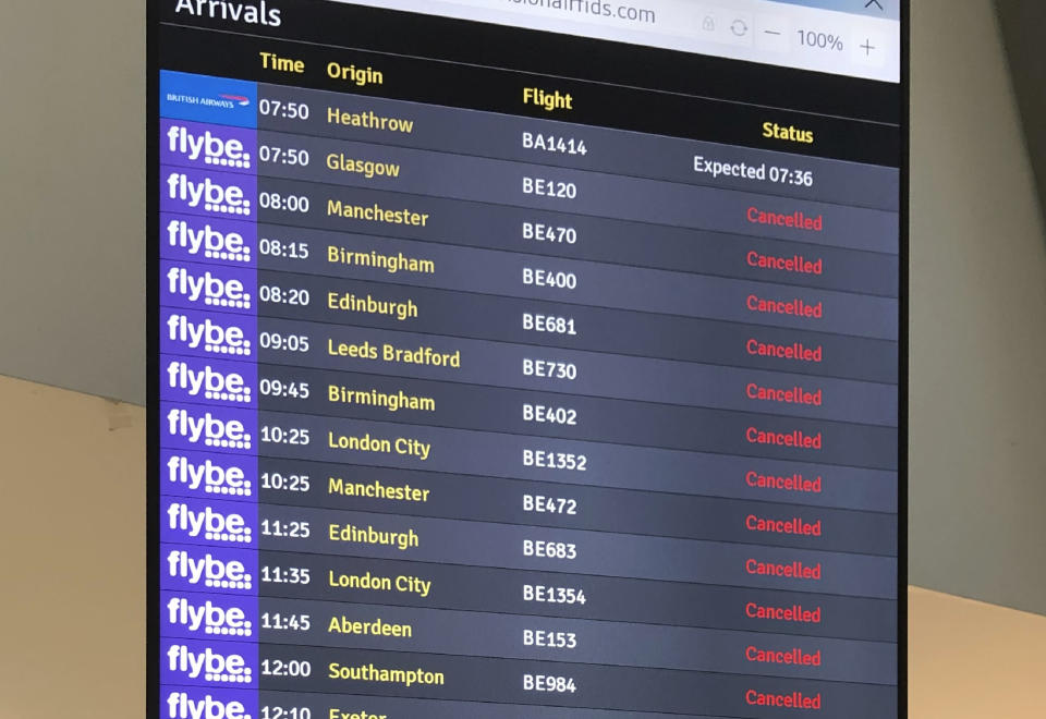 The flight departure boards shows cancelled flights at Belfast Airport in Belfast Thursday, March 5, 2020. The struggling British airline Flybe has collapsed, leaving passengers stranded and told to find their own way home. UK Civil Aviation Authority said in a statement Thursday that financially troubled Flybe had entered administration. (David Young/PA via AP)