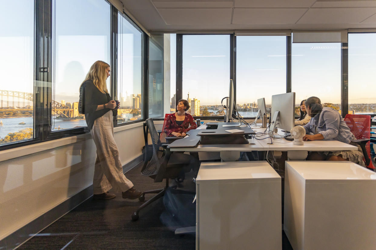 Business Woman With Cerebral Palsy Having a Casual Office Meeting